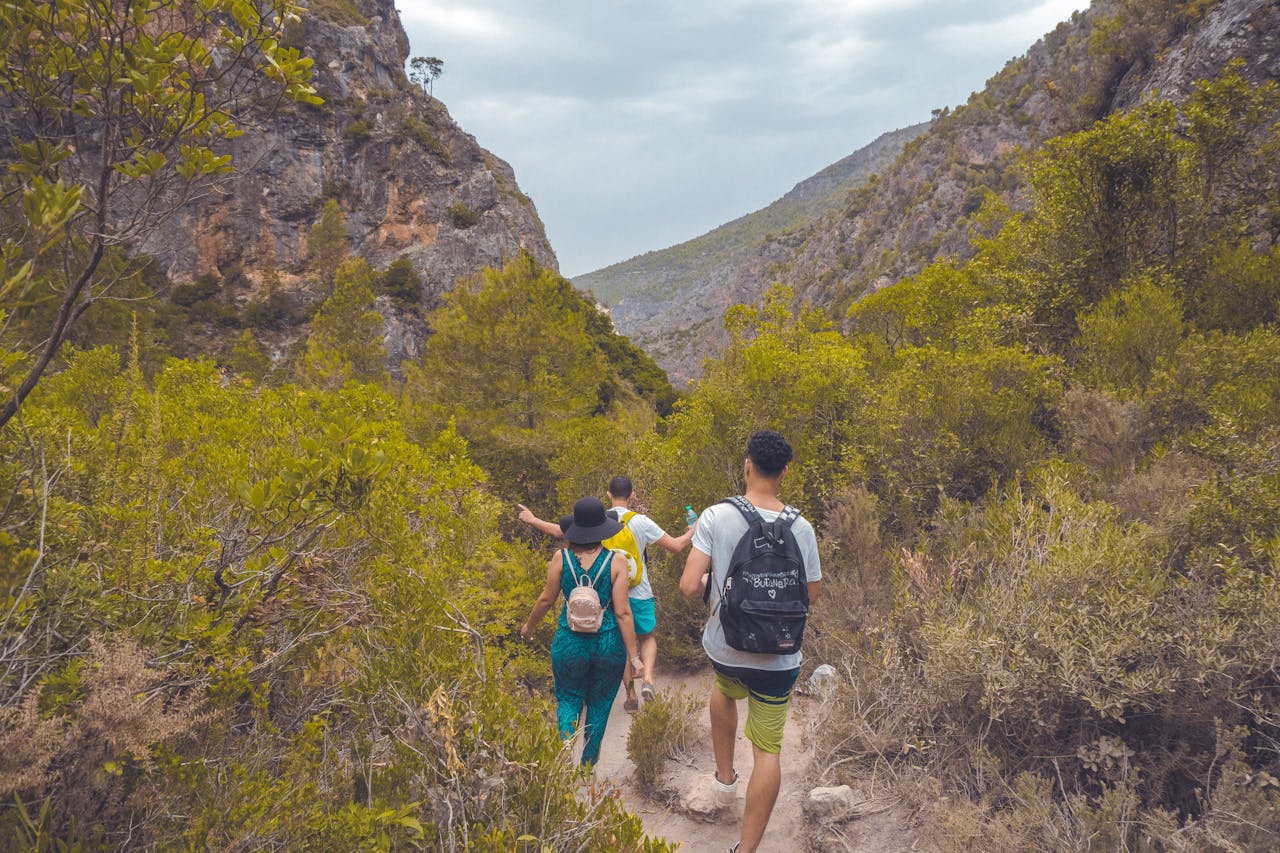 A group of friends hiking through the scenic Akchour mountains in Morocco.