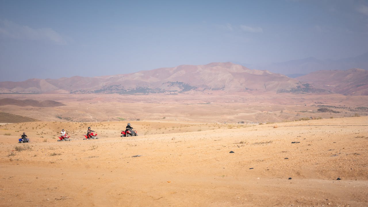 The Art of Drawing Readers In: Your attractive post title goes here Group of quad bikers exploring the vast Agafay desert near Marrakech, Morocco.