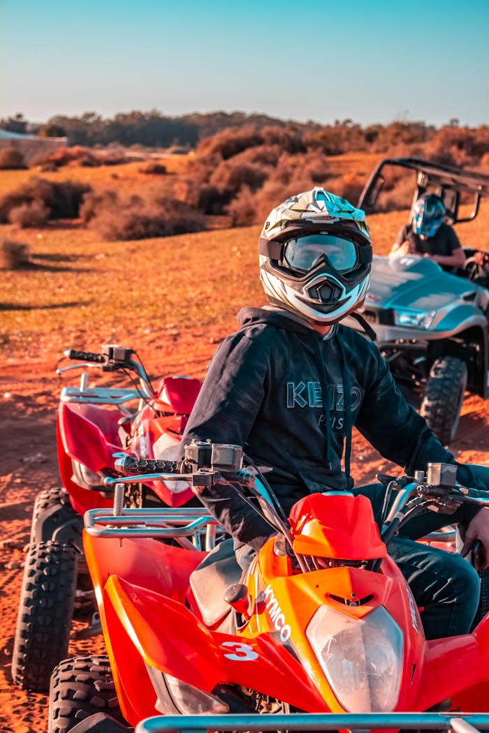 Experience the thrill of quad biking with helmets in Morocco's vast desert landscape.